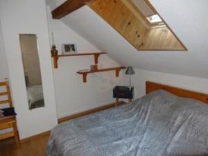 a bedroom with a bed and a wooden ceiling at Appartement Villard-de-Lans, 1 pièce, 4 personnes - FR-1-515-113 in Villard-de-Lans