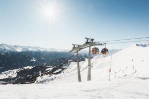 a ski lift on top of a snow covered mountain at Alpine Resort Goies Superior in Ladis