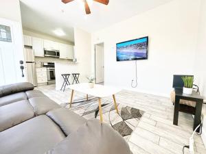 a living room with a couch and a table at Modern Retreat Just Outside The City in San Diego