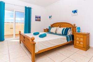 Posteľ alebo postele v izbe v ubytovaní Villa San Andres