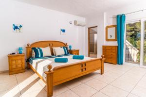 Posteľ alebo postele v izbe v ubytovaní Villa San Andres