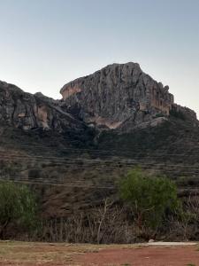a large rocky mountain in the middle of a field at Casa Zuniga B&B in Guanajuato