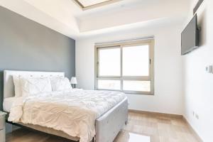 Postelja oz. postelje v sobi nastanitve Luxurious 2BDR with Ocean View