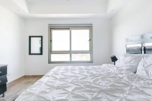 Postelja oz. postelje v sobi nastanitve Luxurious 2BDR with Ocean View