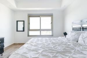 Postelja oz. postelje v sobi nastanitve Luxurious 2BDR with Ocean View