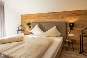 a bedroom with two beds with white pillows at Drei Türme Top A5 in Schruns