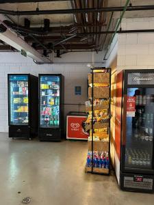 a store with two soda machines in a room at TrevizZo Vergueiro in São Paulo