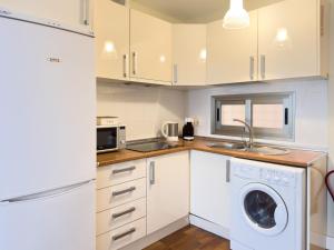 Kuchyň nebo kuchyňský kout v ubytování ApartamentoMálagaCentro