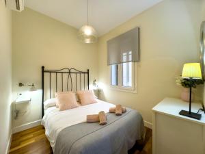 Postel nebo postele na pokoji v ubytování ApartamentoMálagaCentro