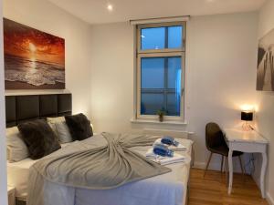 Ein Bett oder Betten in einem Zimmer der Unterkunft Downtown Apartments Leipzig