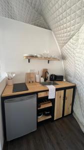 a small kitchen with a counter and a sink at Deer Glamping in Ciudad Lujan de Cuyo