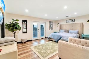 a bedroom with a bed and a couch at Joshua Tree Pool/Spa Villa in Joshua Tree