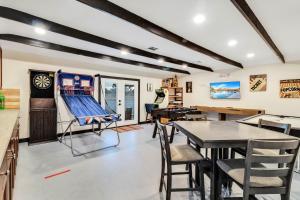 a room with a table and chairs and a baseball at Joshua Tree Pool/Spa Villa in Joshua Tree
