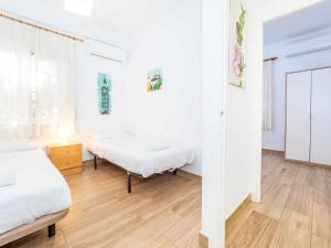 Postel nebo postele na pokoji v ubytování Apartamento en la Playa con Patio Privado
