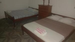 Postel nebo postele na pokoji v ubytování Elitineide Guest House