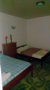 Postel nebo postele na pokoji v ubytování Elitineide Guest House