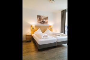 Кровать или кровати в номере Drei Türme Top 5