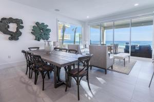 a dining room with a table and chairs at Wait'n on Sundown in Destin