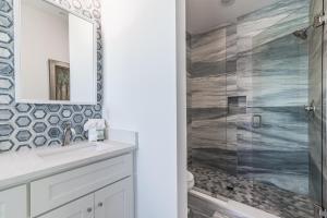 a bathroom with a sink and a shower at Wait'n on Sundown in Destin