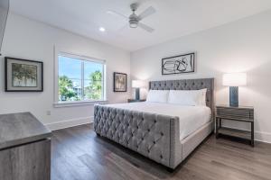 a bedroom with a bed and a window at Wait'n on Sundown in Destin