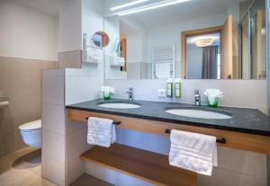 Ein Badezimmer in der Unterkunft Hotel Häuserl im Wald