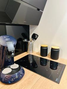 a kitchen with a coffee maker on a counter at Le Rennais - Gare & centre ville in Rennes