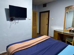 TV a/nebo společenská místnost v ubytování Conord Hotel