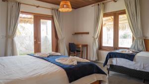 Ένα ή περισσότερα κρεβάτια σε δωμάτιο στο Casa Tajo - Atins +33 φωτογραφίες