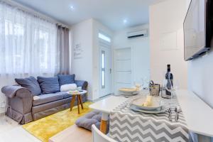 a living room with a couch and a table at Apartment Melki in Split