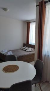 a room with a bed and a table and chairs at Apartment B45 Borovets Gardans in Borovets