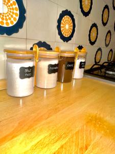 three buckets sitting on top of a kitchen counter at Villa Esclusiva a 3 Piani in Bardonecchia