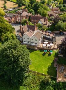 an aerial view of a house with a yard at The Manor at Abberley in Abberley