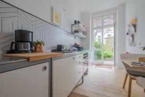 Kuchyň nebo kuchyňský kout v ubytování Design Altbautraum in der City - Nähe DUS & Dortmund & Köln & Essen + 13 fotografií