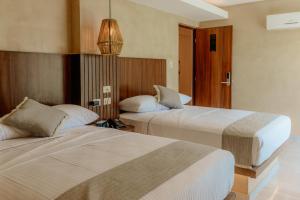 Hotel Yaxactun 객실 침대