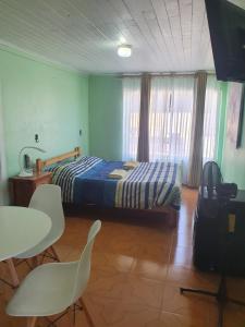 Postel nebo postele na pokoji v ubytování Residencial mi Casa