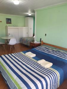 Postel nebo postele na pokoji v ubytování Residencial mi Casa