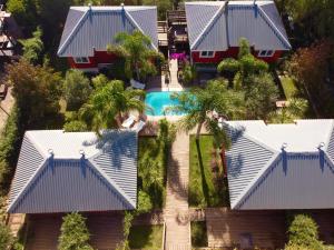 an aerial view of a house with a pool at Bon Amour Punta del Diablo in Punta Del Diablo