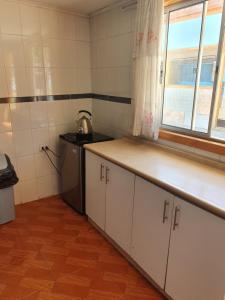 Kuchyň nebo kuchyňský kout v ubytování Residencial mi Casa
