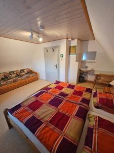 a bedroom with two beds in a room at Naturfreundehaus in Annweiler am Trifels