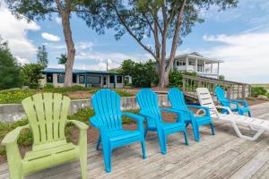 a group of chairs sitting on a deck at Azure Seas in Anna Maria