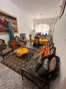 a living room with a couch and a table at A CASA DE IRENE II in Aparecida