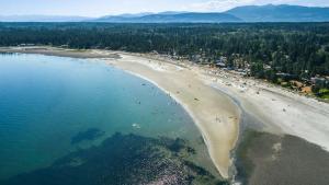 an aerial view of a beach with people on it at The Beach Haven at THE BEACH HOUSE in Campbell River