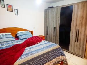 En eller flere senge i et værelse på Country House - Ubatumirim Beach