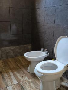 a bathroom with a toilet and a bidet at Vivac Camp in San Rafael
