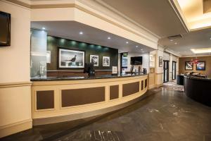 a lobby of a hotel with a reception counter at DoubleTree by Hilton Edinburgh Airport in Ingliston