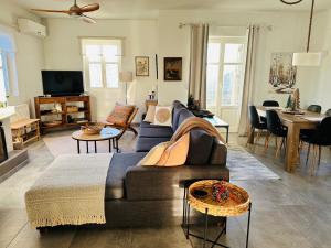 a living room with a couch and a table at Luxury Villa at Pelion- Ruby in Zagora