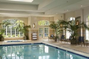 a large swimming pool in a house with a swimming poolvisorvisor at Chic 2BR Durham Haven - Walk to Duke in Durham