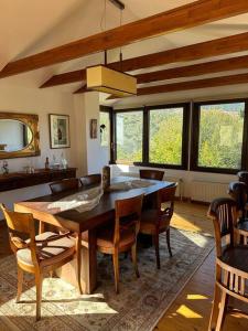 a dining room with a wooden table and chairs at Villa_Kleio in Litochoro