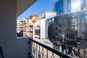 a balcony with a view of a building at Modern & Elegant City Center Apartments in Plovdiv