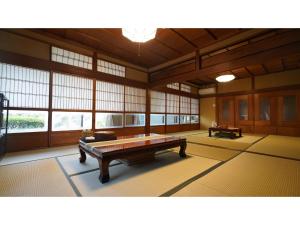 a large room with a table in the middle of it at Uji Tea Inn - Vacation STAY 27201v in Uji